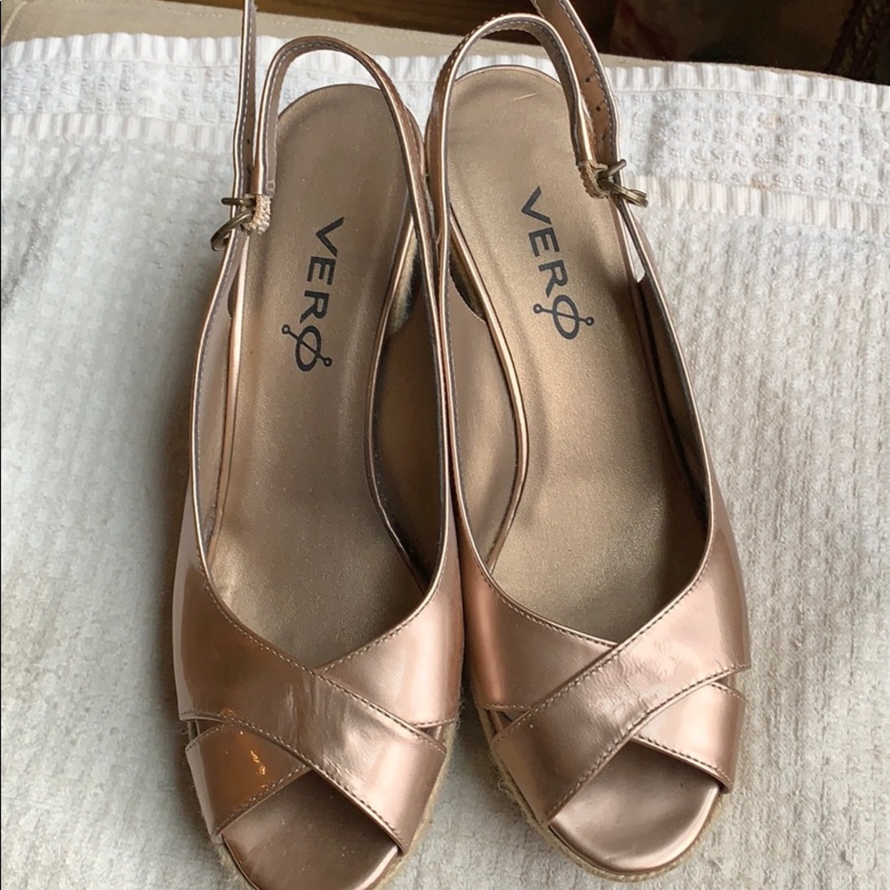 Women’s gold wedged sandals with adjustable strap